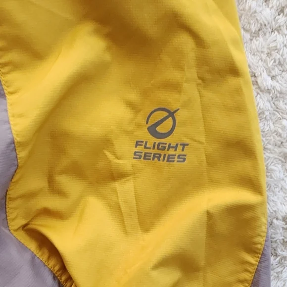 The North Face Flight SerieYellow and Gray Windbreaker.
